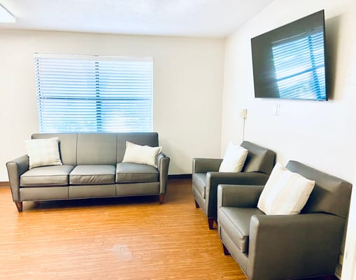 Bright common area with seating arrangements