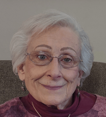 Close-up portrait of an elderly woman smiling