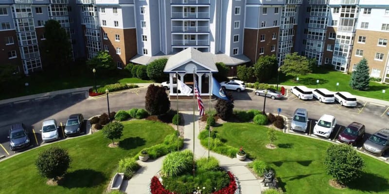 Aerial view of a senior living facility entrance and landscaping