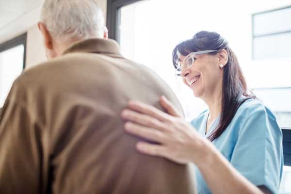 Nurse interacting with a resident in a facility