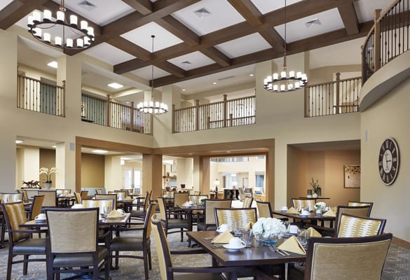 Bright dining room with tables set for a meal