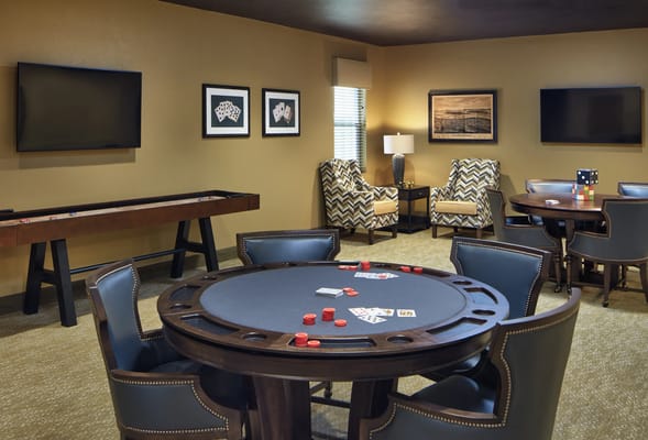Interior view of a game room with a poker table