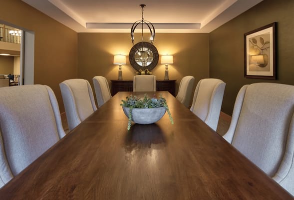 Well-decorated dining room with large table and plants