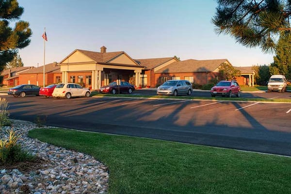 Exterior view of Life Care Center of Casper with parking