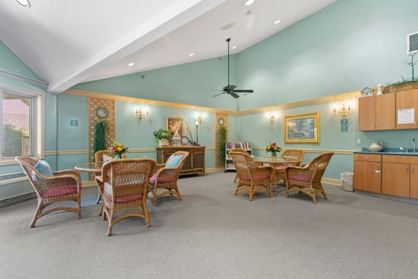 Bright common area with tables and chairs