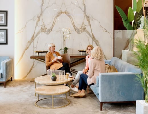 Residents chatting in a stylish common area