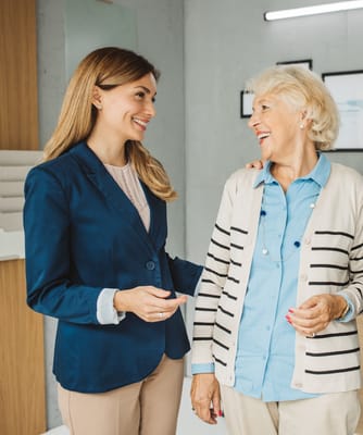 Staff member engaging with a resident in a common area