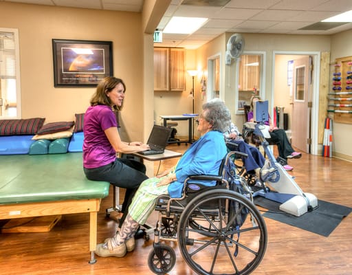 Staff member interacting with a resident in a common area