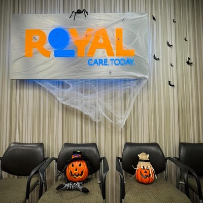 Halloween-themed decorations with pumpkins in waiting area at Royal Care