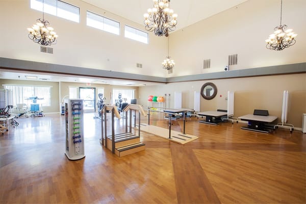 A bright activity room with exercise equipment