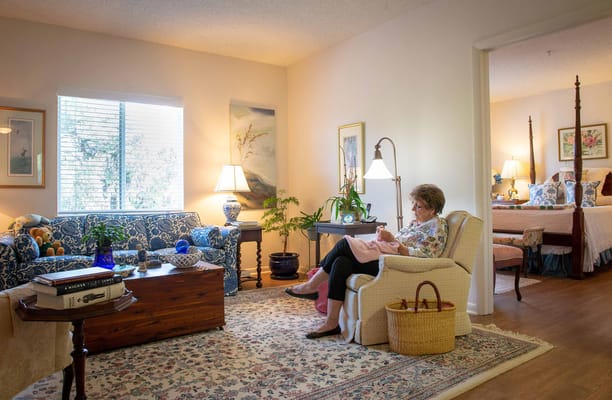 Cozy interior with a resident reading in a living area