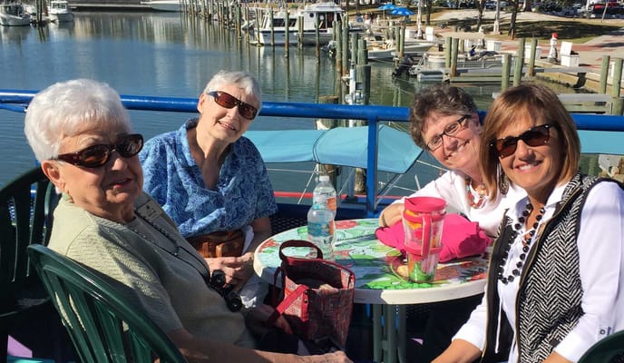 Residents enjoying a day outdoors by the marina