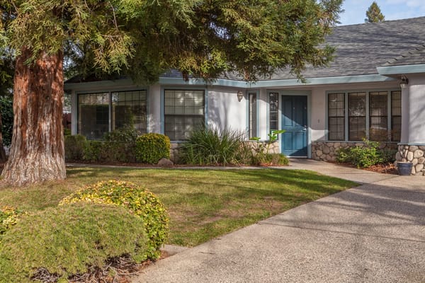 Exterior view of the Almond Blossom Assisted Living building