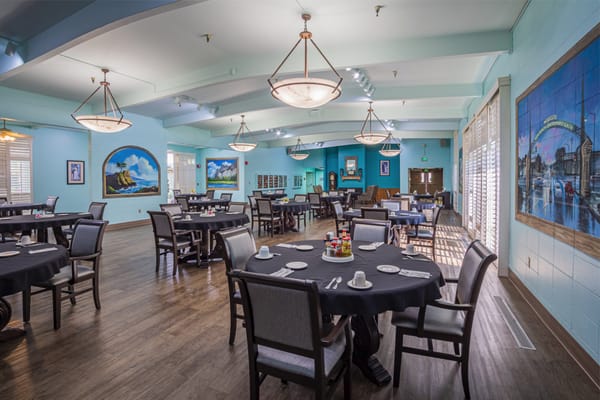 Interior view of a dining room with tables and chairs