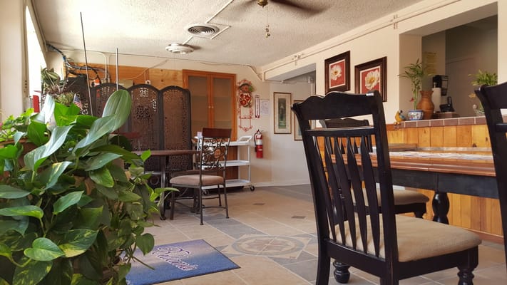 Common area with tables and chairs for residents
