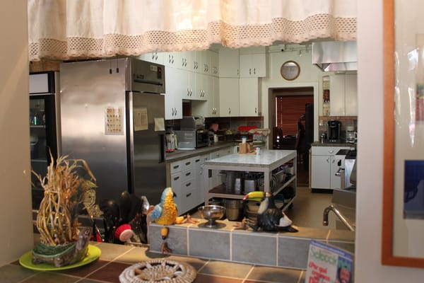 Bright kitchen area with cooking appliances and decor