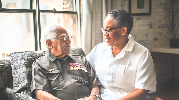 A caregiver engaging with a senior resident in a cozy interior