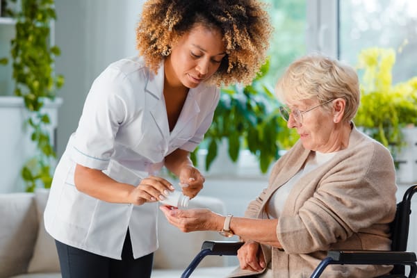 Nurse assisting a senior resident in a bright room