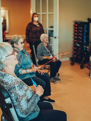 Residents engaged in a recreational activity indoors
