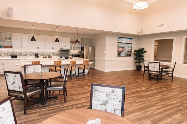 Bright dining area with modern furniture and kitchen