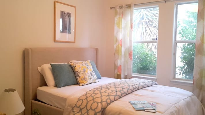 Cozy bedroom with natural light and colorful decor