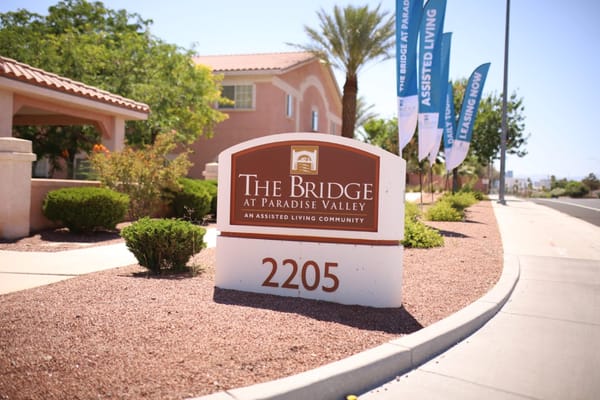 Sign for The Bridge at Paradise Valley, an assisted living community.