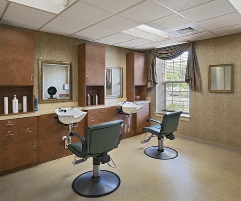 Salon area with styling chairs and mirrors