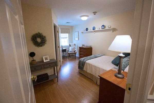 Cozy resident room with a bed and chair