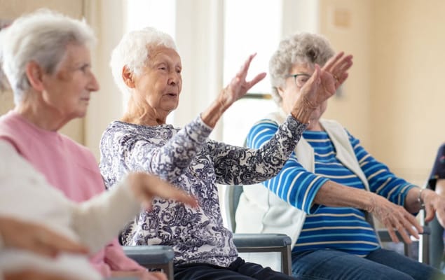 Residents engaging in an activity during a group session