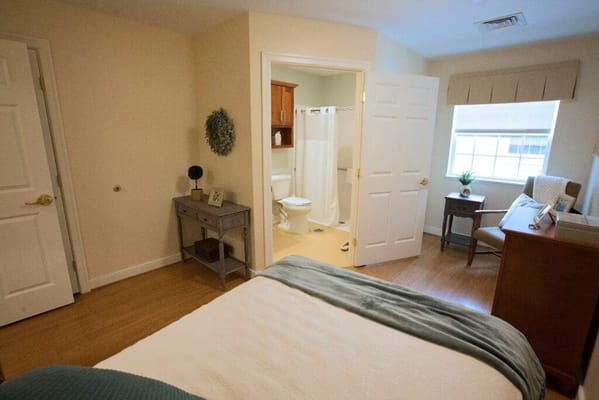 Cozy resident room with a bed and sitting area