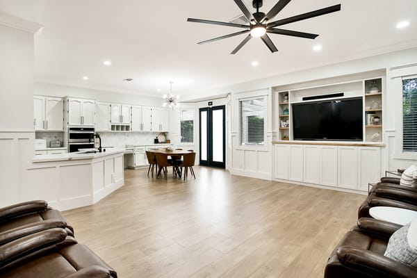 Bright common area with modern furnishings and large windows