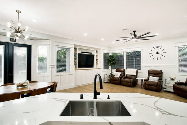 Bright common area with seating and entertainment space