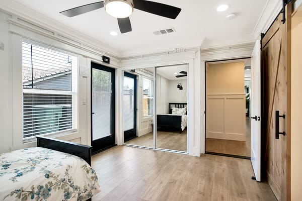 Bright interior of a resident room with bed and closet