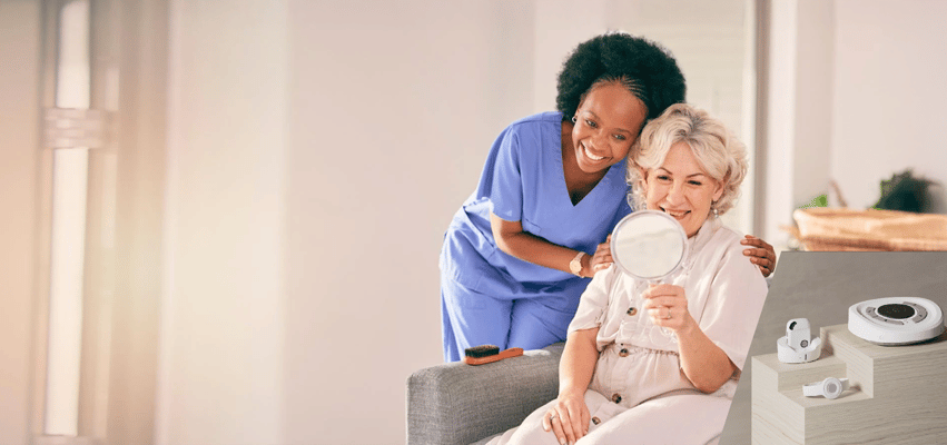 A caregiver assists a resident in a bright room