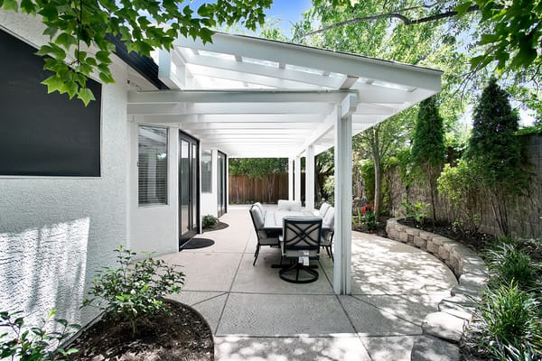 Outdoor patio area with seating under a pergola