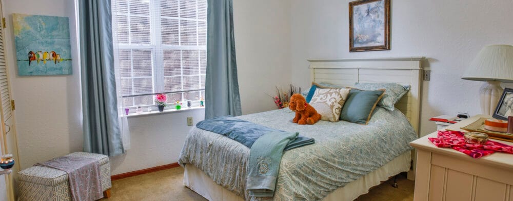 Cozy resident room with a bed and decorative items