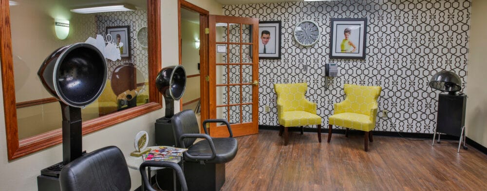 Interior view of a salon area with chairs and styling equipment