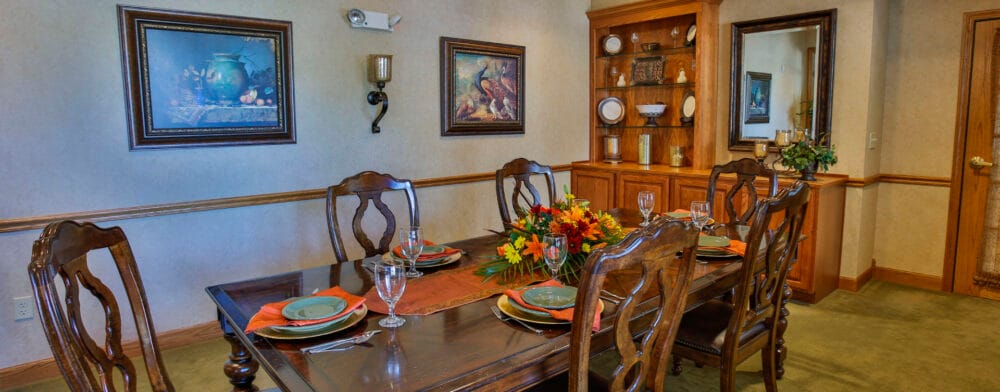 Dining table set for a meal in a facility dining room