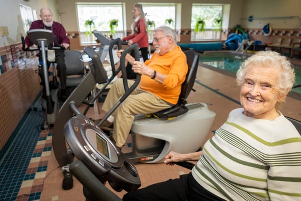 Residents exercising in a wellness center