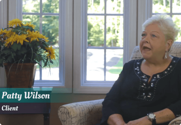 Client testimonial in a sunny common area