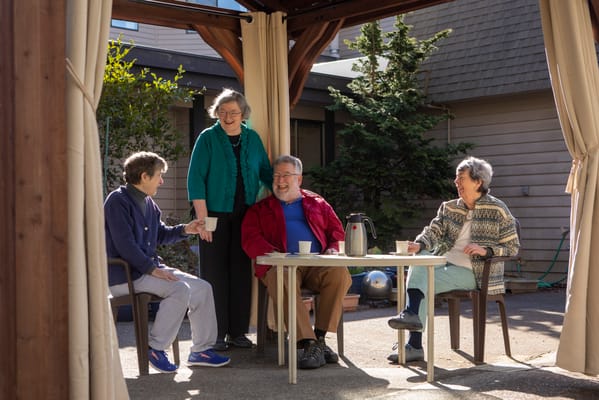Residents enjoying a gathering in an outdoor space
