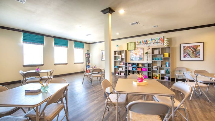 Bright common area with tables and colorful decorations