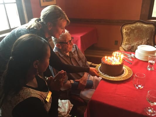 Residents celebrating a birthday with cake