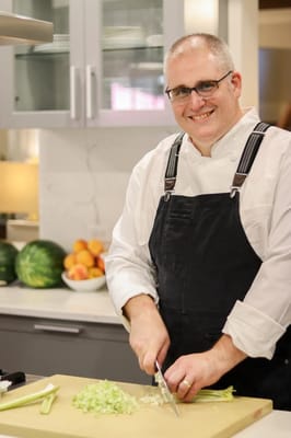 Chef preparing ingredients in a modern kitchen
