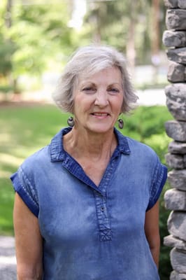 Smiling resident in a garden setting