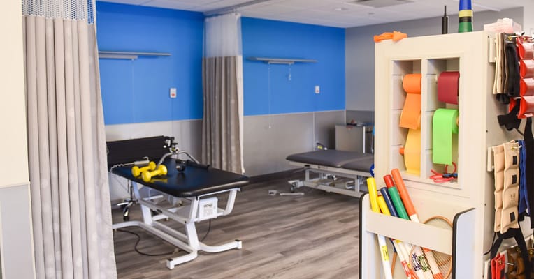 Therapy room with equipment for exercise and rehabilitation