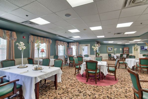 Dining area with tables set for residents