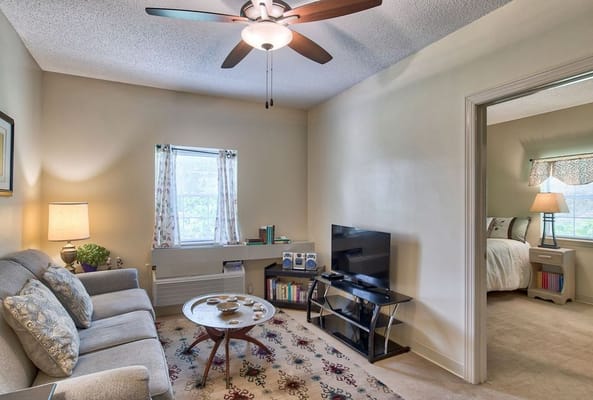 A cozy interior living space with a couch and TV