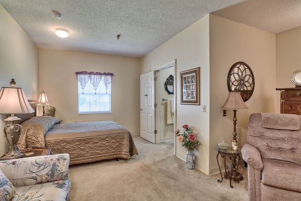 Cozy resident room with bed and seating area