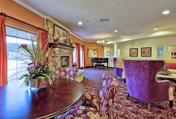 Common area with plush seating and piano